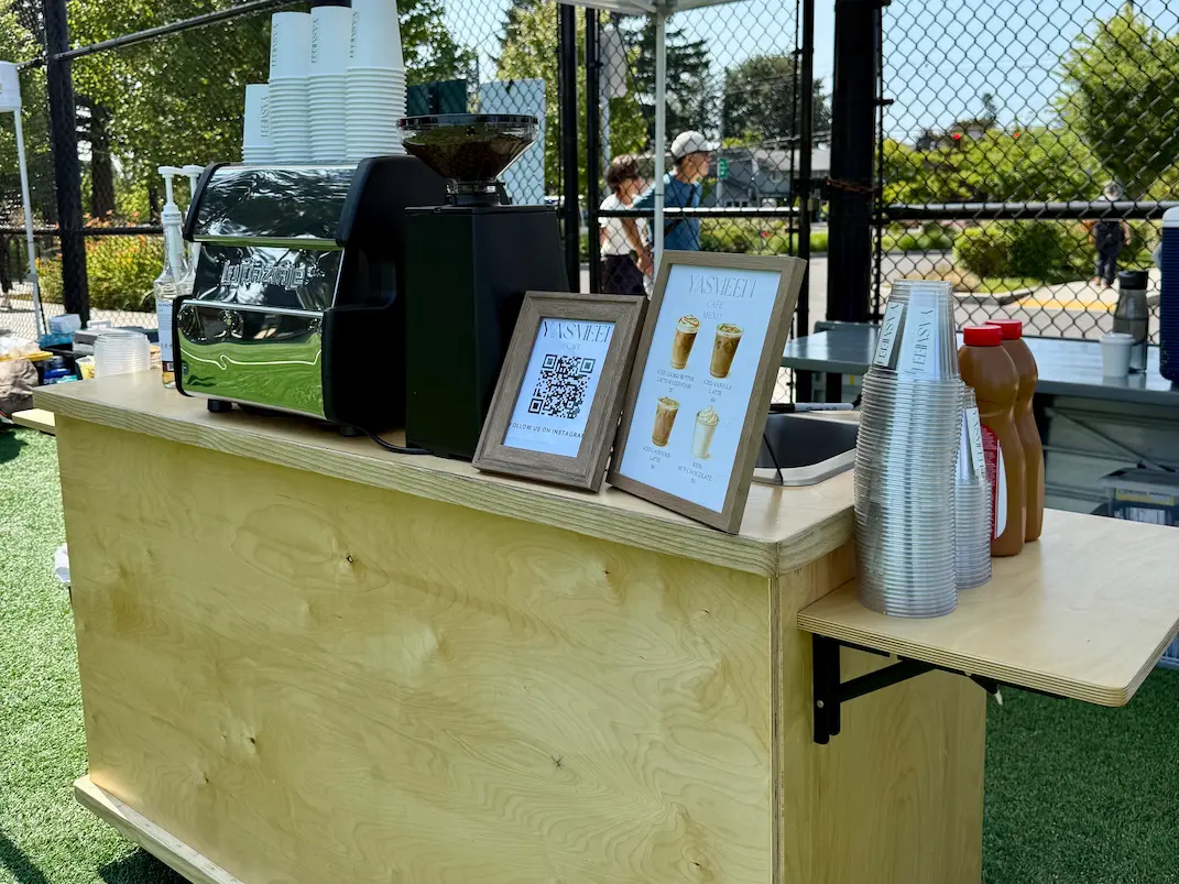 Yasmeen Cafe showcasing the mobile coffee cart with drinks